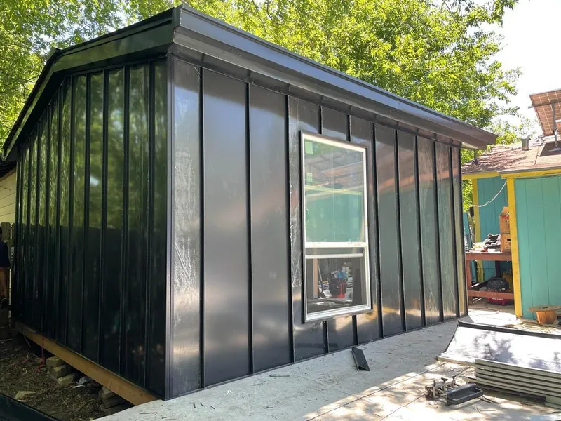 Black standing seam metal wall panels for Roof Inspection in Sayre